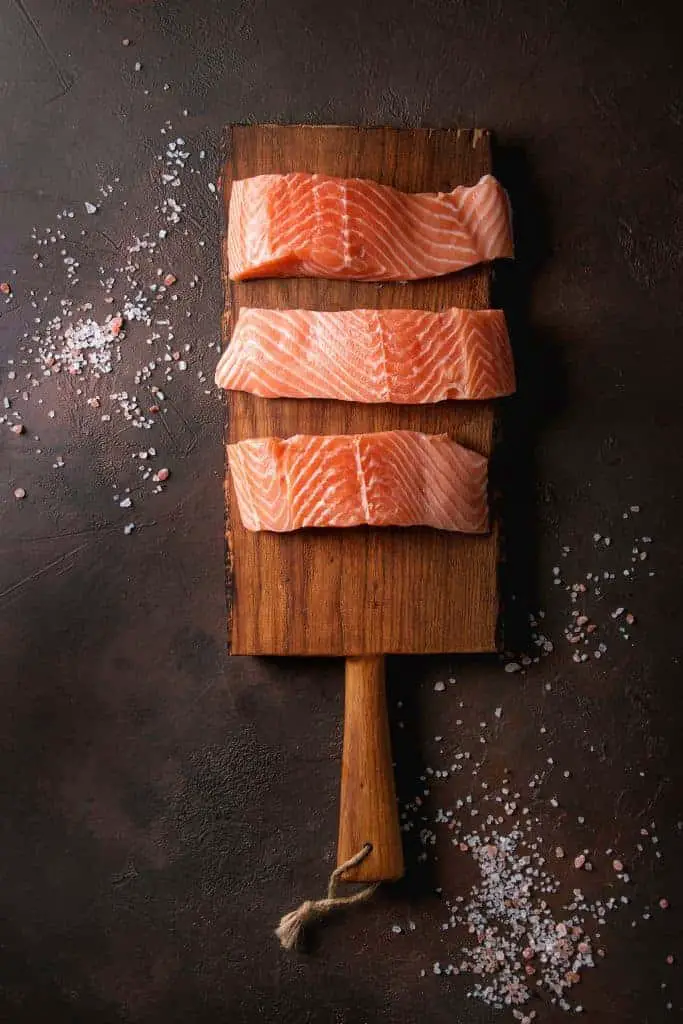 Salmon Fillets On Wood Plank